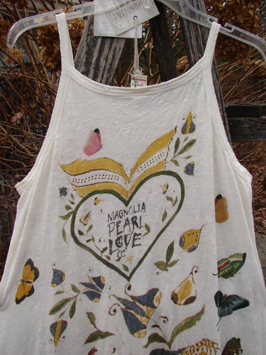 Magnolia Pearl NWT Cotton Jersey Lana Tank Dress features a sleeveless, lightweight design with a heart and floral motif, showcasing raw edges and a sweeping A-line fit, embodying vintage charm.