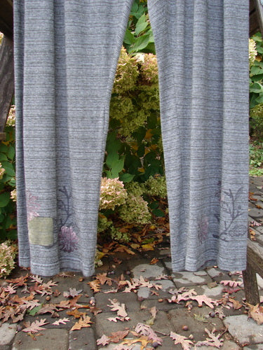 2000 Rayon Lycra Stripe Duo Cliffshadow Stripe Size 2 pants featuring floral patterns and a full elastic waistband, showcased on an outdoor wooden porch.