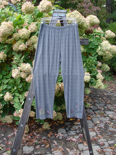 2000 Rayon Lycra Stripe Duo Cliffshadow Stripe Size 2: Striped pants displayed on a wooden ladder, showcasing full elastic waistband and bottom flare, part of a vintage Blue Fish Clothing collection.