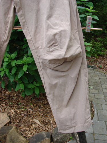 2000 Parachute Trekker Pant Unpainted Dove Size 0 hanging on a clothesline, showcasing its medium-weight cotton fabric, elastic waistline, and additional knee fabric detail.