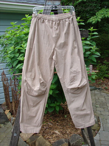 2000 Parachute Trekker Pant Unpainted Dove Size 0, hanging on a clothesline, showcasing its sturdy, tightly woven fabric, elastic waistline, and additional knee fabric from the Spring Collection of 2000.