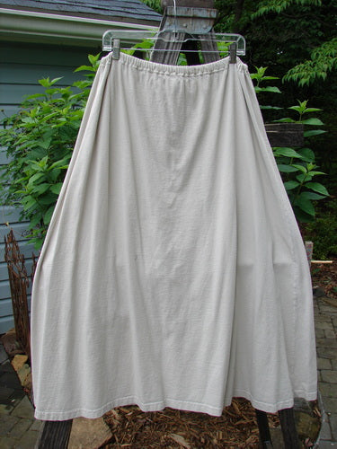 1994 Everywhere Skirt Magical Fish Mist Size 1 hanging on a clothesline outdoors, showcasing a full A-line shape with a drawcord waistline and a fun lower front pocket in the Diamond Fern Theme.