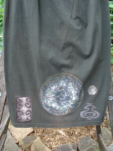 1992 Straight Skirt Holiday Metallic Medallion Black Sand Size 1, featuring a continuous metallic medallion design with a full elastic waistline, slightly straightened shape, and a blue fish signature patch at the rear.