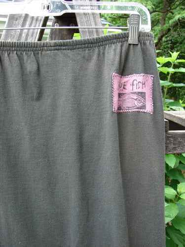 1992 Straight Skirt Holiday Metallic Medallion Black Sand Size 1, featuring a pink patch and full elastic waistline, showcased in perfect condition with a slightly straightened shape.