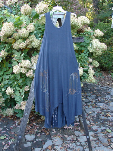 1998 Rayon Lycra Botanicals Tendril Mayflower Duo Onyx Size 1: A blue dress with botanical theme paint displayed on a wooden ladder.