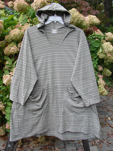 2000 Resort Hooded Pocket Pullover Zig Zag Black Olive Grey Stripe Size 2 featuring a hood, rounded neckline, and front pockets, modeled outdoors.