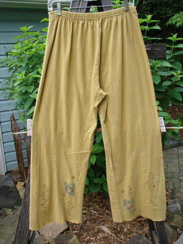 2000 Hemp Cotton Archive Pant Sun Gold Altered Size 0 hanging on a clothesline, showcasing sectional belled legs and elastic backing with a paneled front for a perfect spring or fall fit.