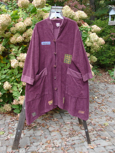 2000 Patched Bette Robe Coat Murple Size 2: A purple robe with vintage buttons and angular pockets, made from heavy cotton chenille.