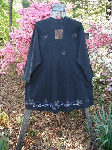 1997 Rhadha Dress Star Flowers Trail Obsidian Size 2, knee-length with three-quarter sleeves, features silvery floral motifs, a mandarin collar, and a unique Blue Fish patch on the back.