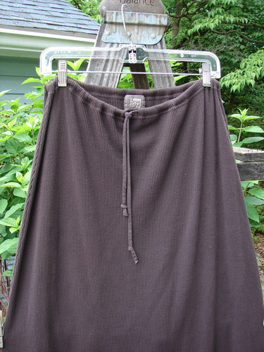 2000 Thermal Grattan Skirt Bubble Brum Size 1 displayed on a clothes rack, featuring a full drawstring waistline, paneled and painted hemline, and sectional lower horizontal panel from the Winter Collection of 2000.