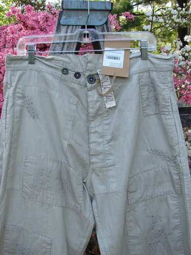 Magnolia Pearl NWT European Denim Lilou Trouser Natural Pinstripe OSFA features relaxed straight-leg cut, patch-style detailing, adjustable button fly, and belt loops, showcasing textured stitchery and raw edges on European cotton denim.