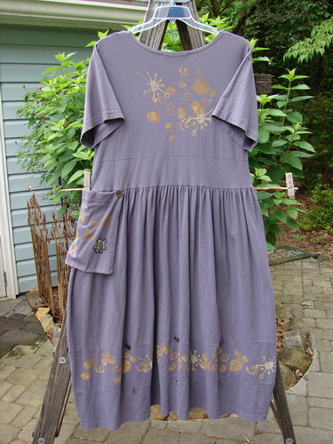 1996 Constellation Dress Butterfly Purple Martin Size 1, featuring gold designs, adjustable hemline with loops and buttons, removable pocket, and a full gathered skirt. Perfect condition, mid-weight organic cotton.