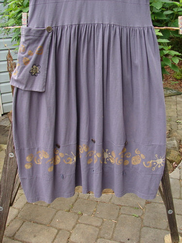 1996 Constellation Dress Butterfly Purple Martin Size 1: A purple dress with gold designs, adjustable hemline, rear buttons, and a full gathered skirt, epitomizing vintage Blue Fish Clothing's creative freedom.
