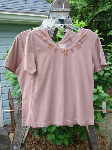 2000 Cotton Lycra Short Sleeved Layering Tops Necklace Coralline Size 1 displayed on hangers, showcasing a fitted, shapely design with a rounded neckline and stretch fabric ideal for layering.