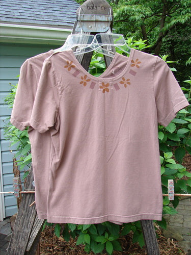 2000 Cotton Lycra Short Sleeved Layering Tops Necklace Coralline Size 1 displayed on hangers, showcasing a fitted, stretchy design with a rounded neckline, ideal for layering.