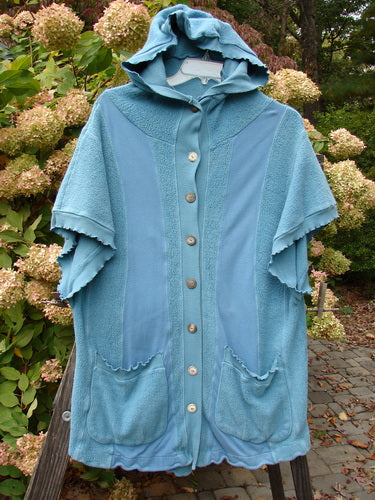 Barclay Celtic Moss Hooded Pocket Cardigan Unpainted Dusty Aqua Size 0 with a floppy hood, short sleeves, full button front, and two lower exterior pockets, showcasing unique textures and curly edgings.