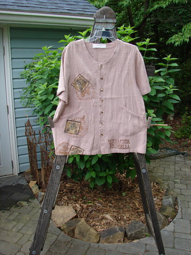 1998 Botanicals Robin's Top Bee Mallow Size 0 displayed on a wooden stand, showcasing its A-line shape, dual front pockets, and garden-themed paint.