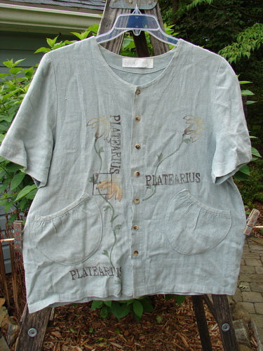 1998 Botanicals Robin's Top Platearius River Size 0, featuring garden-themed prints, dual front pockets, and seven buttons, displayed on a hanger.