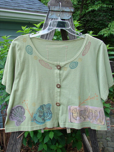 1993 Travel Top Beach Treasure Kelp Altered Size 2 with scooped neckline, crop shape, beach-themed design, blue fish patch, and wooden buttons on a hanger.
