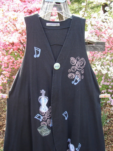 1996 State Fair Vest Music Festival Storm Size 1: A sleeveless, apron-style dress with musical motifs and a single button, hanging outdoors. Part of Bluefishfinder's vintage collection, celebrating individuality and creativity.