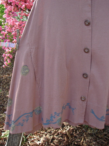 1993 Short Column Vest Floral Vine Rosewood OSFA: A lightweight vest with a button-front, flared hem featuring a blue vine motif, hung outdoors, epitomizing Bluefishfinder.com's vintage, expressive style.