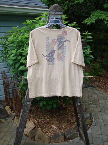 1994 Camp Shirt Berry Fern Garden Flaxen Altered Size 1 displayed on a hanger, features a varying hemline, wider neckline, oversized breast pocket, drop shoulders, and detailed fern garden paint.