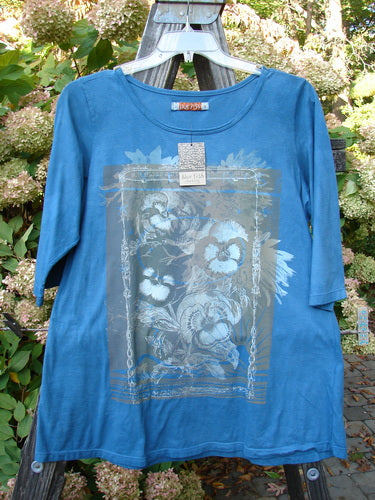 Barclay NWT Modern Slim Tee Top Pansy Mottled Teal Size 1 featuring three-quarter sleeves, lower hip flare, rounded hemline, and contour pansy design on a blue shirt with an organic cotton texture.