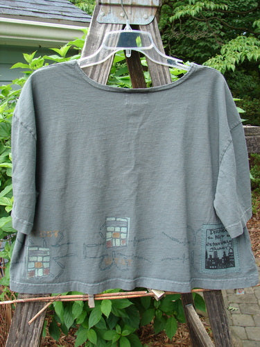 2000 City Side Crop Tee Top Go West Park Size 0 displayed on a hanger, featuring directional border paint, wide swingy shape, and painted sleeve accents.