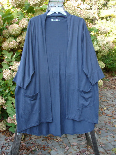 Barclay Bamboo Dolman Day Jacket in Navy with vintage floral rear, open front, cuffed sleeves, and two front pockets, displayed on a hanger.