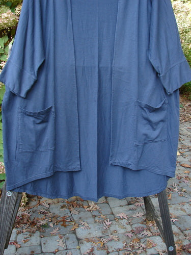 Barclay Bamboo Dolman Day Jacket with vintage floral rear, open front, two exterior pockets, and dolman sleeves, displayed on a rack.