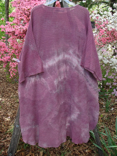 Barclay Crinkle Gauze Ana Tunic Dress in Mottled Rusty Rose, featuring a loose fit, wide three-quarter sleeves, and a varying hemline. Exhibits a subtle tie-dyed effect, perfect for individual expression.
