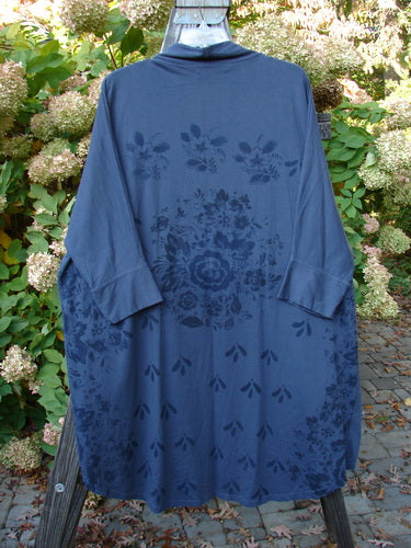 Barclay Bamboo Dolman Day Jacket in Navy with a vintage floral design, featuring an open front, two pockets, cuffed sleeves, and varying hemline. Made from a soft, organic cotton blend.