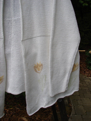 1999 Rollneck Cardigan Sweater Pastel Tulip Pure White OSFA, featuring lovely dual knitting and sectional rolled seams, with a cropped slightly rolled back line and pastel tulip design on a white background.