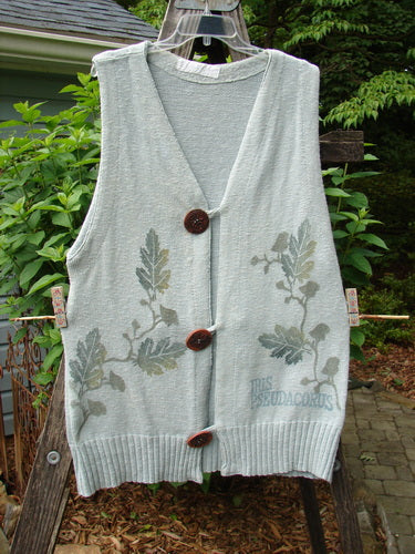 1998 Botanicals Sprig Vest River Altered Size 1 displaying oversized handmade stoneware buttons, deep V neckline, varying ribbed textures, and delicately stitched loop closures, hanging on a clothes hanger.