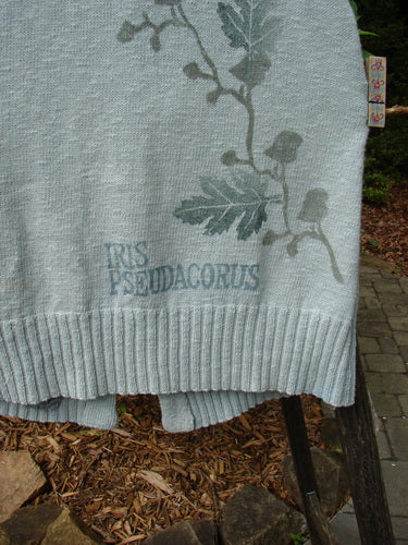 Close-up of the 1998 Botanicals Sprig Vest River Altered Size 1, showcasing intricate ribbed textures, handmade stoneware buttons, deep V neckline, and delicately stitched loop closures.