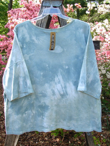 Barclay NWT Cotton Lycra Writer's Pocket Pullover Sweatshirt Leaf Mottled Asper OSFA, displayed on a garden ladder, showcases seamless design with a rounded neckline and dual drop pockets.