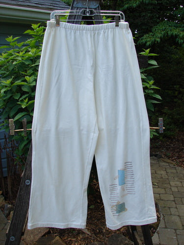 2001 Cotton Lycra Matchstick Pant Junk Drawer Fizz Size 2 hanging on a clothesline, showcasing its thin waistband, wide bottoms, and pock-less design for a slimming look.