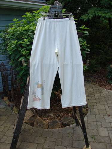 2001 Cotton Lycra Matchstick Pant Junk Drawer Fizz Size 2 on a rack, featuring a thin waistband, wide bottoms, and a sleek, pocketless design for a slimming look.