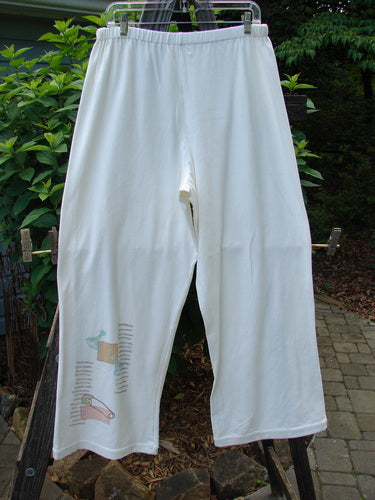 2001 Cotton Lycra Matchstick Pant Junk Drawer Fizz Size 2 hanging on a clothesline, showcasing its thin waistband and wide bottoms.
