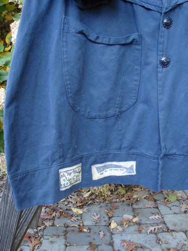 Barclay PMU Patched Twill Decora Brushed Flutter Coat Travel Navy Size 1 with 3/4 flutter sleeves, deep V neckline, dark buttons, and large drop pockets, featuring a rich, weighted brushed twill fabric.