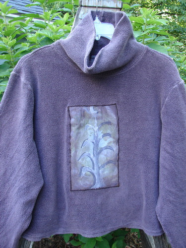 2000 PMU Celtic Moss Big Collar Top Aubergine Size 2: A plush, dense purple fleecy sweatshirt with a front leaf patch, a Blue Fish signature patch on the lower back, and a swingy A-line shape.