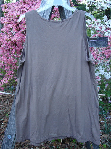Barclay Lightweight Basic Tank Top Unpainted Dusty Bark Smaller Size 2 on a hanger, showcasing its loose cut and rounded neckline, ideal for layering with its lightweight organic cotton fabric.