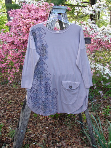 Barclay Long Sleeved Pop Top Celtic Spirograph Stone Size 1, features an oversized fit with drop shoulders and a button-flap pocket. The geometric print adds a unique touch.