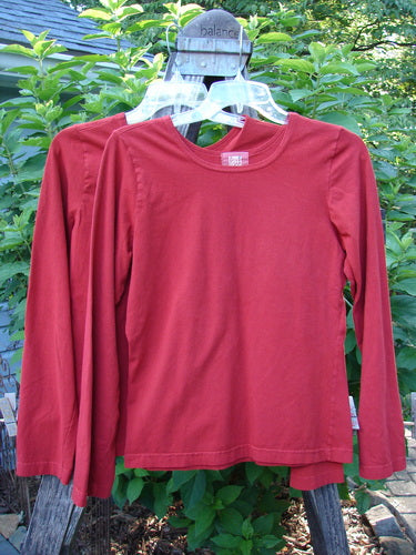 2000 Cotton Lycra Long Sleeved Layering Tops Unpainted Bittersweet Size 1 displayed flat, showcasing fitted and shapely design with a rounded feminine neckline and stretchy, substantial fabric, ideal for layering.