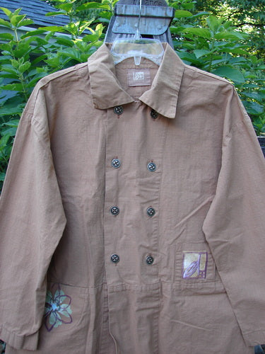 2000 Parachute Double Button Jacket Floral Carmel Altered Size 1 displayed on a hanger, showcasing its double-breast design, metal buttons, rounded hem, cuffed sleeves, and rear walking vent.