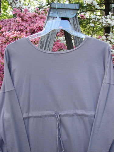 Barclay Long Sleeved Pop Top Celtic Spirograph Stone Size 1 on hanger, featuring a scoop neckline, drawstring waist, oversized front pocket with textured button, and spirograph design, highlighting vintage charm.