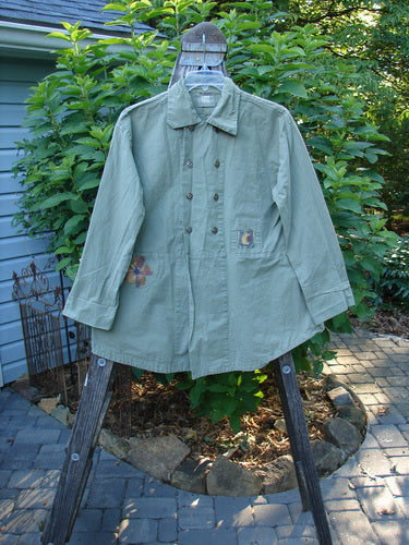 2000 Parachute Double Button Jacket Floral Eucalyptus Size 0 displayed on a swinger, highlighting its double-breasted design with metal buttons, cuffed sleeves, front pockets, and a rear walking vent.