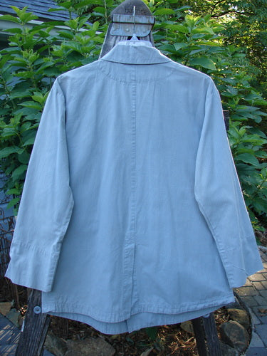 2000 Parachute Double Button Jacket Floral Robin's Egg Altered Size 0 displayed on a hanger, showcasing its double-breasted design, cuffed sleeves, metal buttons, and two front pockets.