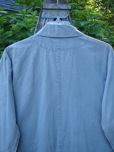 2000 Parachute Double Button Jacket Floral Robin's Egg Altered Size 0 displayed on a hanger, showing its double-breasted design, cuffed sleeves, and unique metal buttons with a rounded hem.