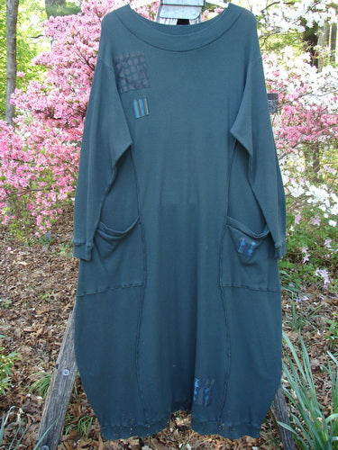 Barclay Patched Thermal Curve Dress Forest Size 2 features a loose, long-sleeved design with unique fabric patches and deep pockets, highlighting Bluefishfinder.com's vintage-inspired, expressive clothing line.
